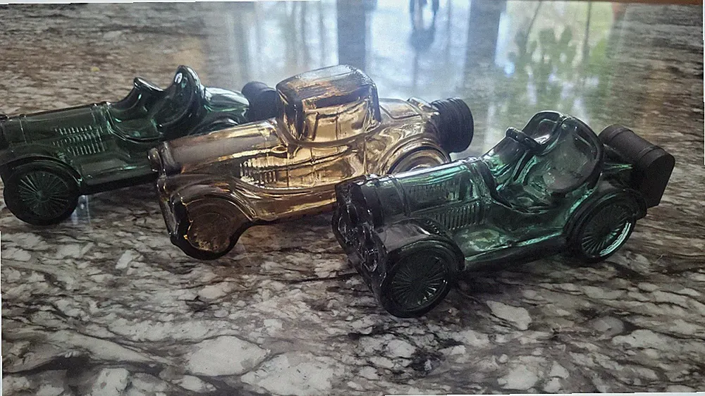 Vintage empty avon cologne bottles cars
